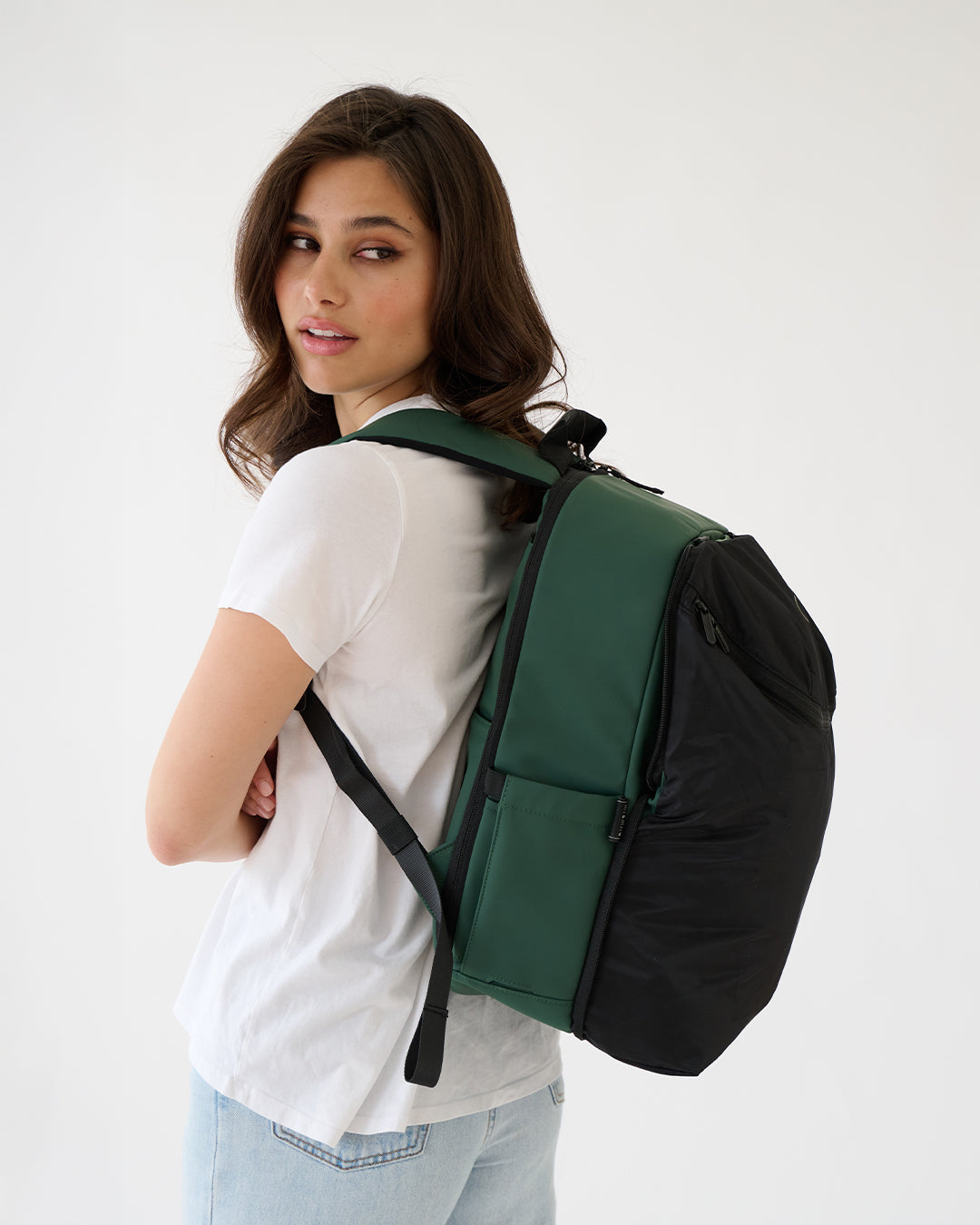 MiaMily Forest Green Expandable Backpack showing multiple compartments and adjustable straps for versatile carrying.