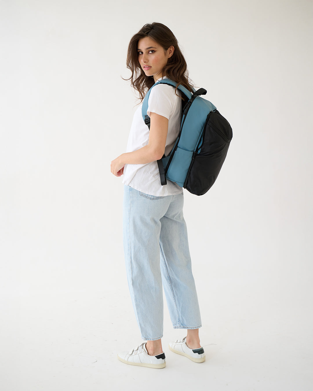 MiaMily expandable backpack in slate blue with multiple compartments and adjustable straps, designed for versatile everyday use.