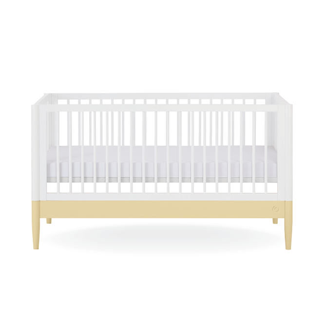 White Gaia Baby Eos cot bed with primrose yellow accents, showcasing a sturdy wooden frame and classic design for nursery use.