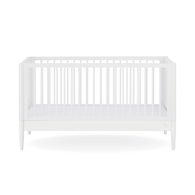 White Gaia Baby Eos cot bed with a sleek frame, shown in a modern nursery setting with a mattress and bedding.