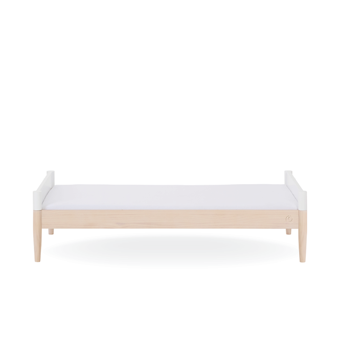White Gaia Baby Eos Cot Bed with natural ash accents, sturdy wooden frame, and slatted sides for safety and style.