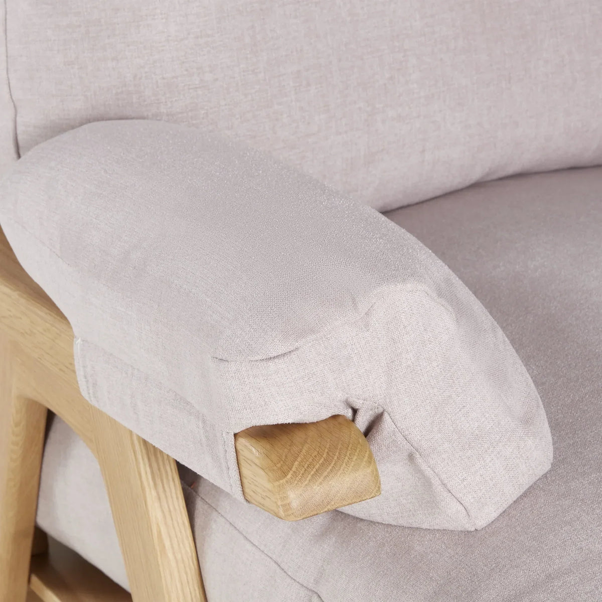 Gaia Baby Hera Rocking Chair in natural oak finish with blush cushions, featuring a modern wooden design and comfortable curved seat.