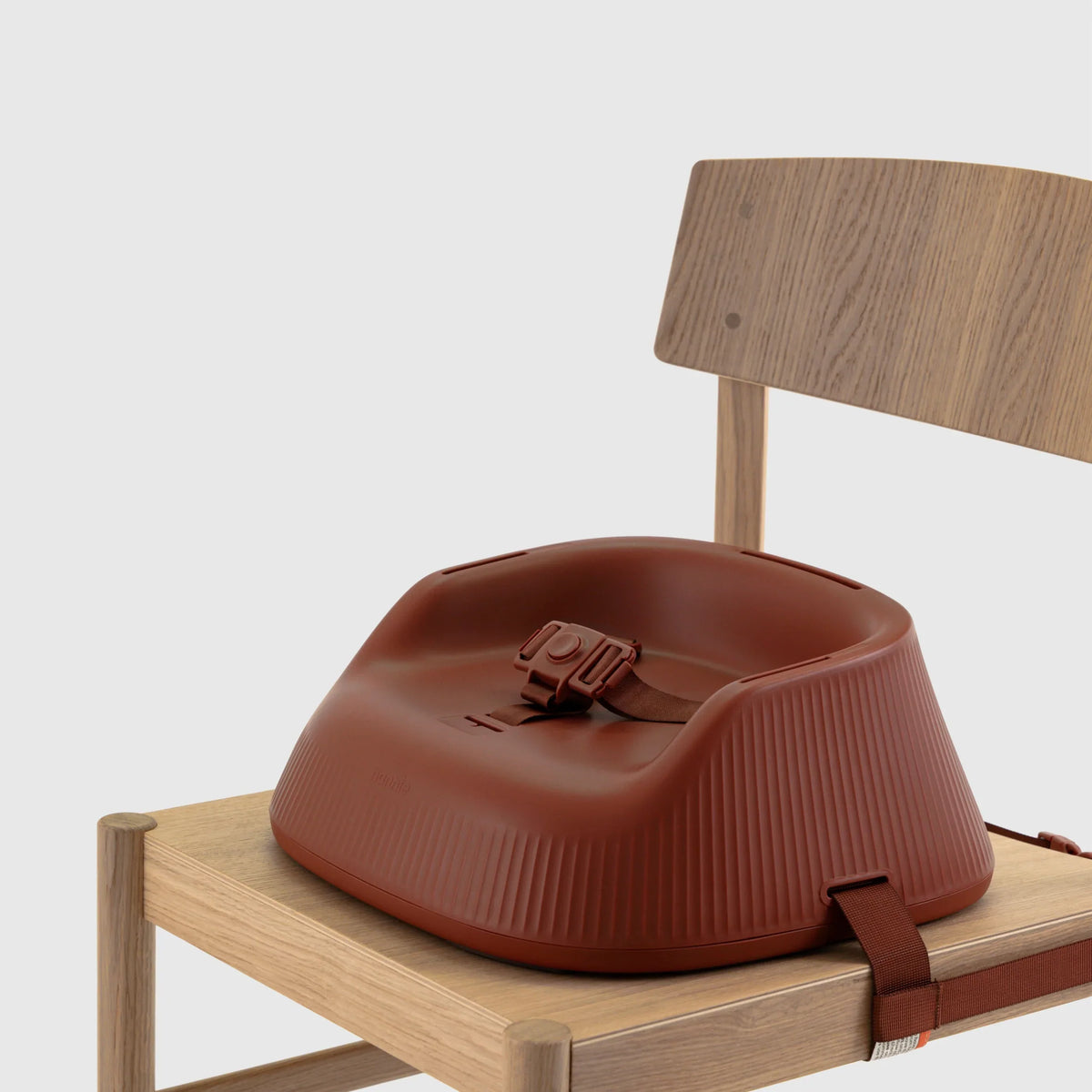 Hannie portable high chair in mahogany red with adjustable seat and safety straps, designed for easy use and comfort.