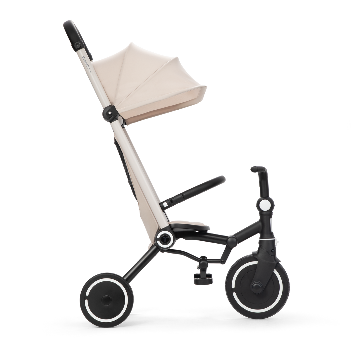 Smartrike Wonder+ Sand toddler tricycle with sturdy frame and comfortable seat for young children, outdoors on a paved surface.