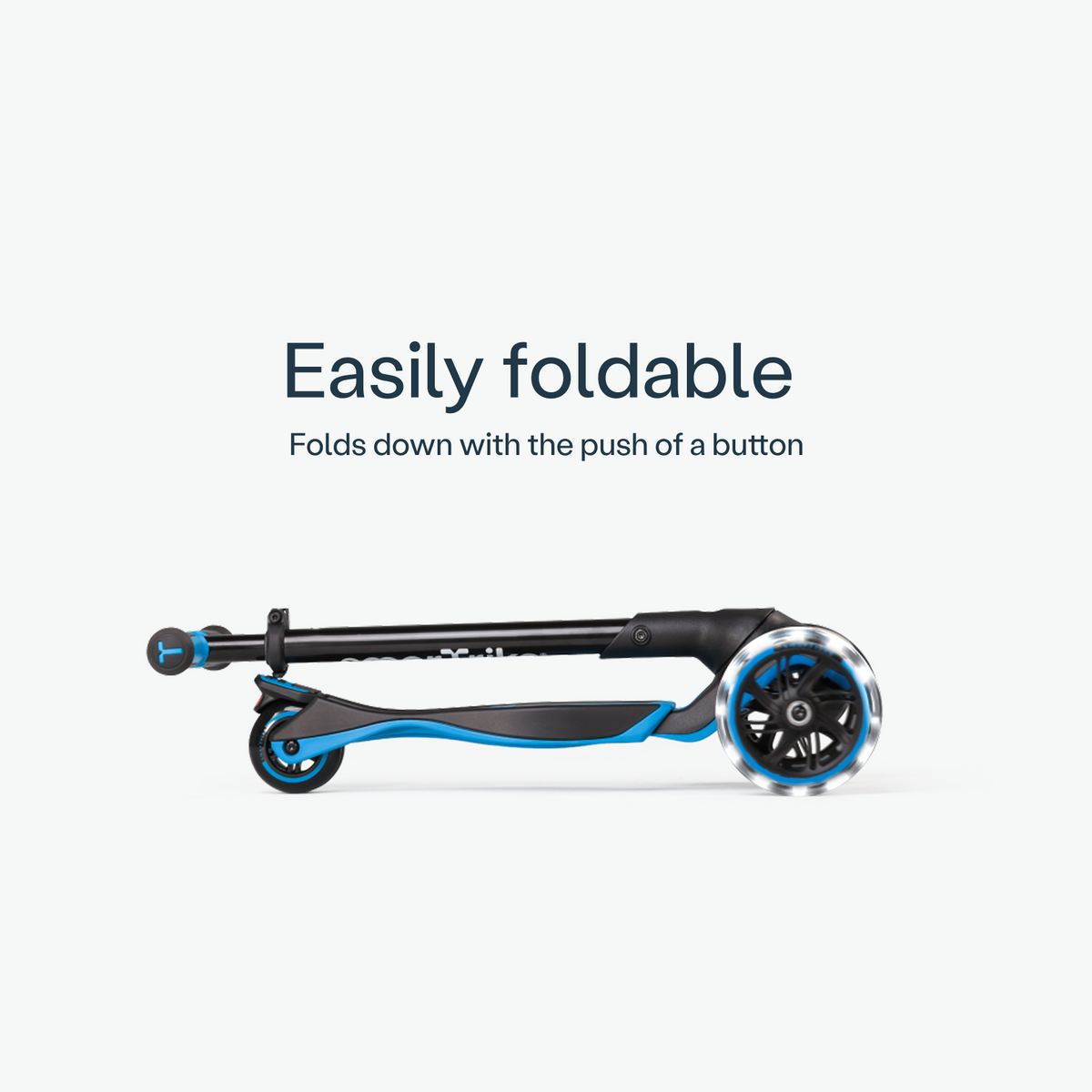 Folded blue smarTrike Xtend Ride-on scooter, compact and portable, with a sleek design and sturdy wheels.