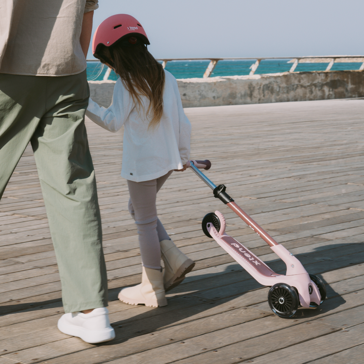 smarTrike Xtend Mini+ scooter with adjustable handlebar and compact design, suitable for young children, shown in a side view.