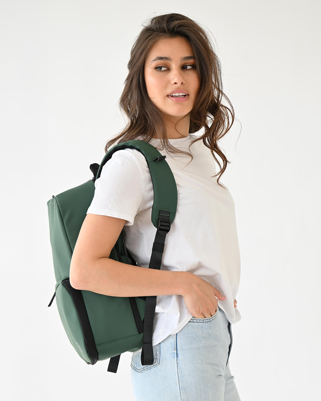 MiaMily expandable backpack in forest green with multiple compartments and adjustable straps, suitable for travel and daily use.