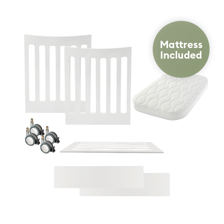 Gaia Baby Serena Mini Cot Adaptor with included mattress, showing the compact cot bed with soft bedding and safety features.