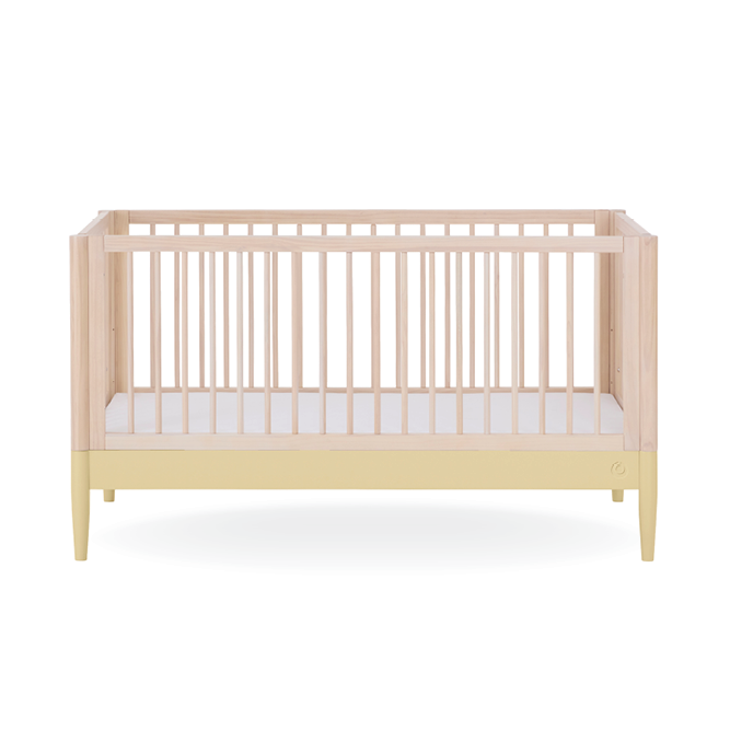 Eos Cot Bed by Gaia Baby in natural ash finish with primrose yellow accents, showcasing the sturdy wooden frame and mattress support.
