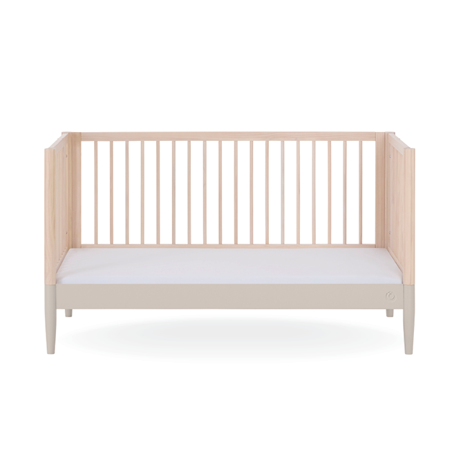 Gaia Baby Eos Cot Bed in natural ash finish with soft cashmere bedding, showcasing a sturdy wooden frame and modern design.