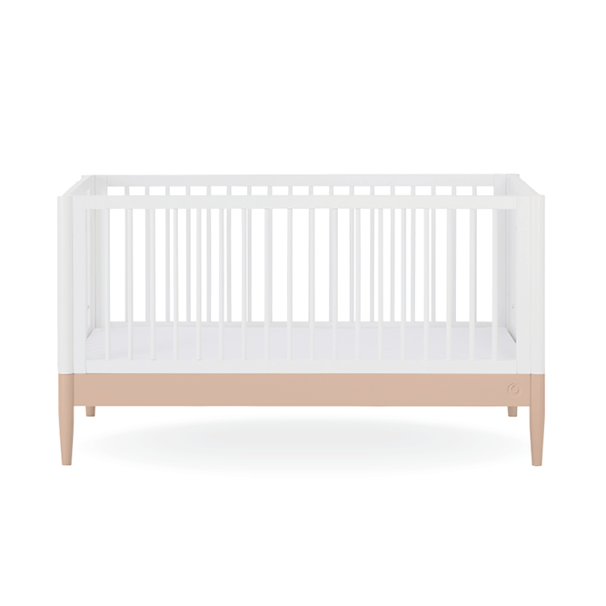 White Gaia Baby Eos Cot Bed with powder blush accents, showcasing a sturdy wooden frame and classic design for nursery use.
