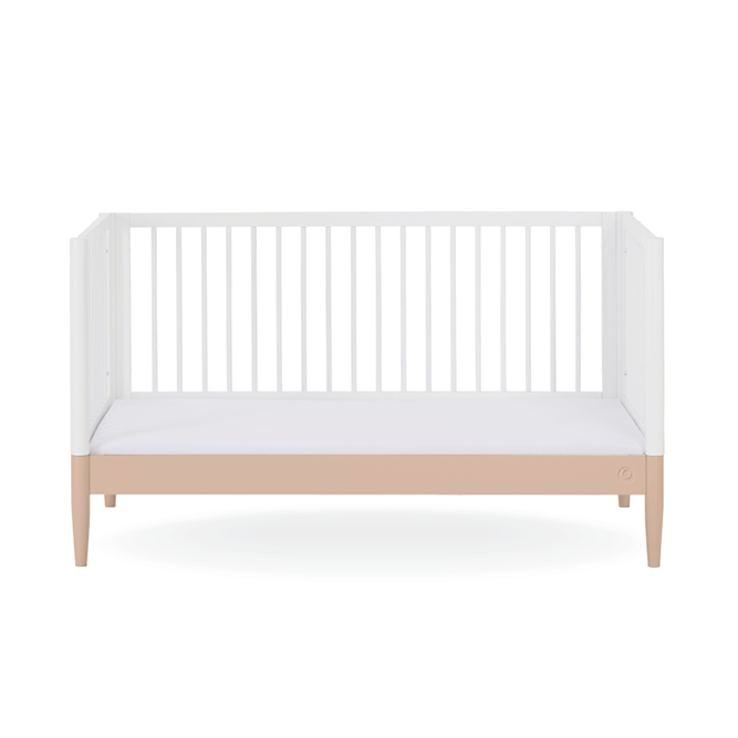 White Gaia Baby Eos Cot Bed with powder blush accents, sturdy wooden frame, and slatted sides for safe, stylish baby sleep space.