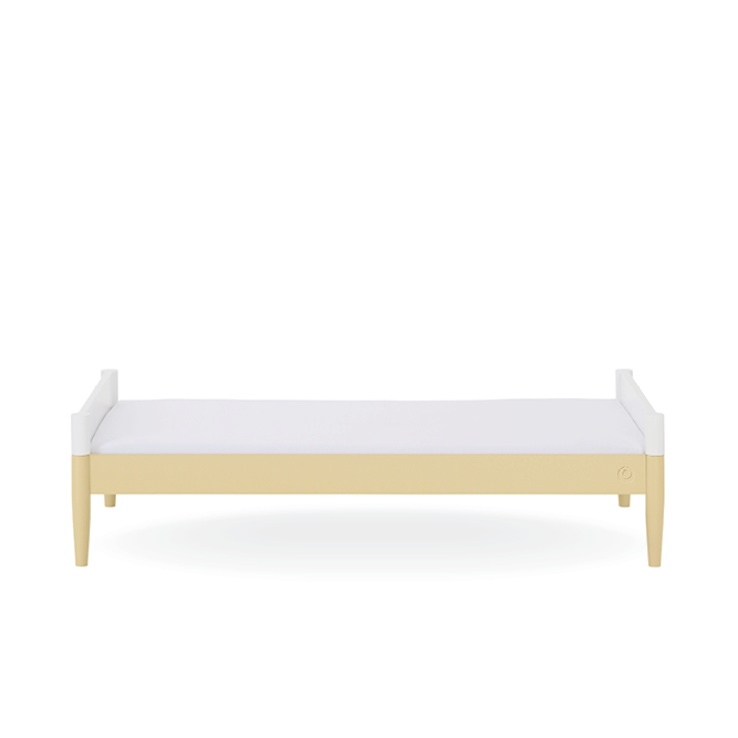 White Gaia Baby Eos cot bed with Primrose Yellow accents, featuring a sturdy wooden frame and adjustable sides.