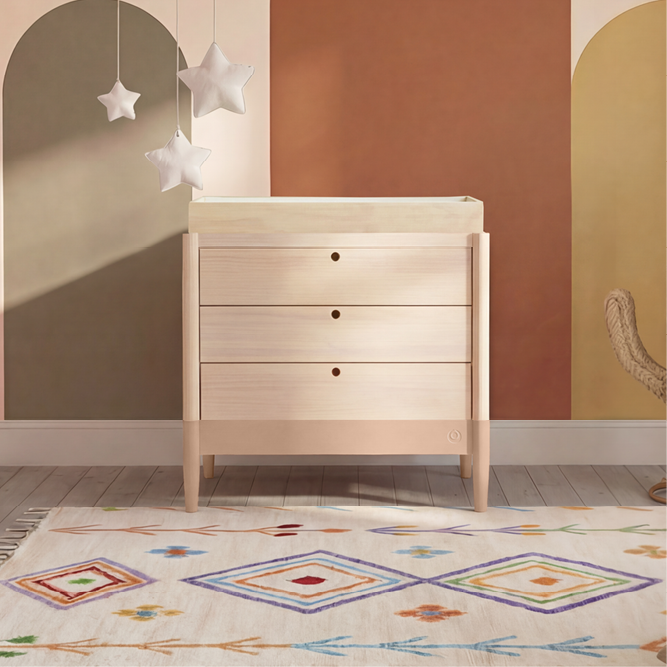 Gaia Baby Eos Dresser in natural wood finish, featuring multiple drawers for storing baby clothing and essentials.
