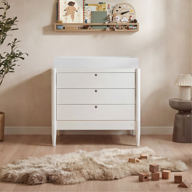 White Gaia Baby Eos Dresser with multiple drawers, sleek design, and modern style for nursery storage.