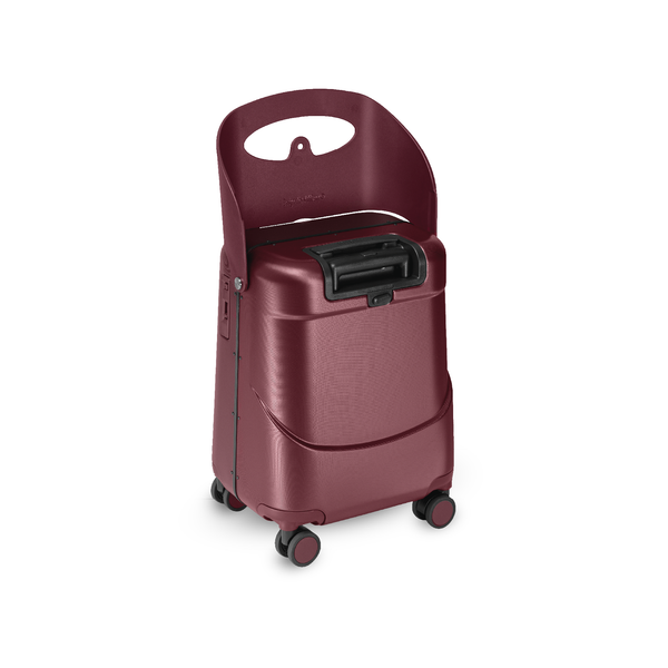 MiaMily Carry On Plus suitcase in burgundy red with hard shell exterior, four spinner wheels, and extendable handle for travel.