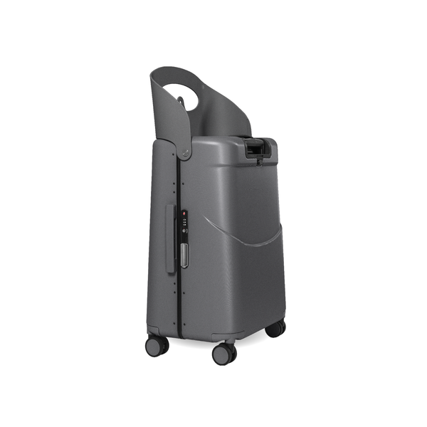 MiaMily Check In suitcase in charcoal grey with four wheels, telescoping handle, and spacious interior for travel.