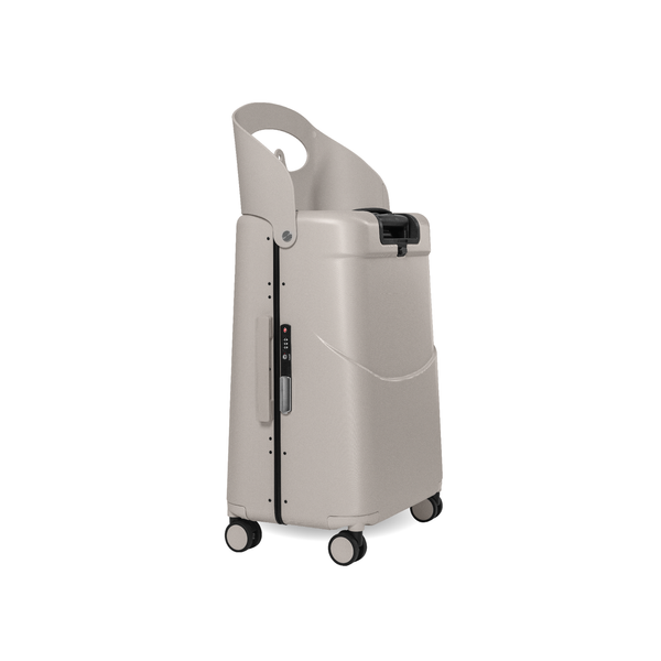 MiaMily Check In suitcase in Mist Grey with hard shell exterior and four spinner wheels for easy travel.