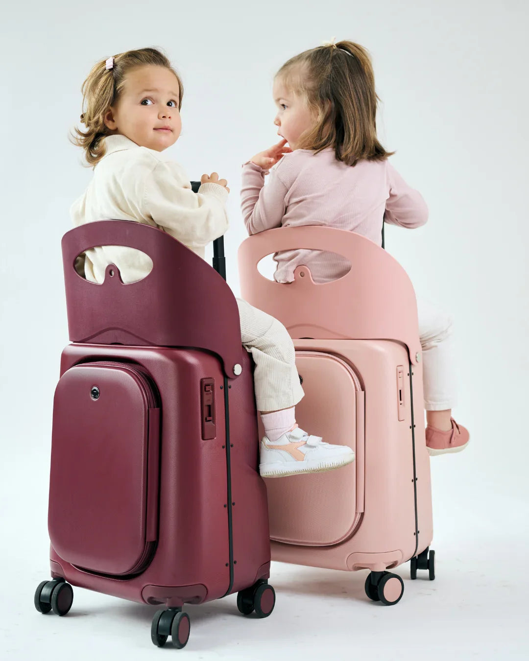MiaMily Carry On Plus suitcase in burgundy red with wheels and retractable handle, lightweight travel luggage.